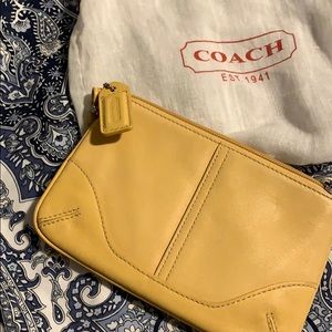 Small coach wristlet and dust bag buttery